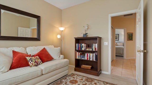 living room with light tile patterned flooring