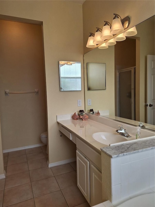 bathroom featuring vanity, toilet, a shower with door, and tile patterned flooring