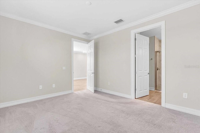 carpeted empty room with ornamental molding