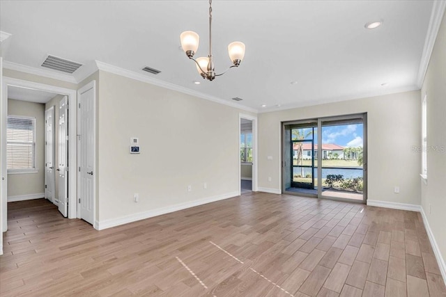 unfurnished room featuring a notable chandelier, crown molding, and light hardwood / wood-style flooring