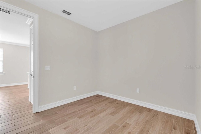 empty room with light wood-type flooring