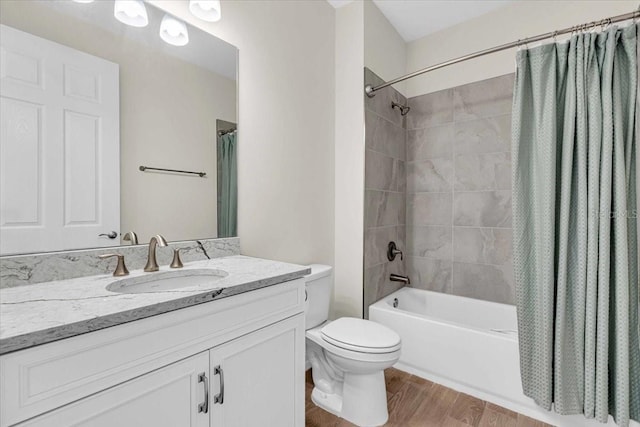 full bathroom featuring hardwood / wood-style flooring, toilet, vanity, and shower / bath combination with curtain