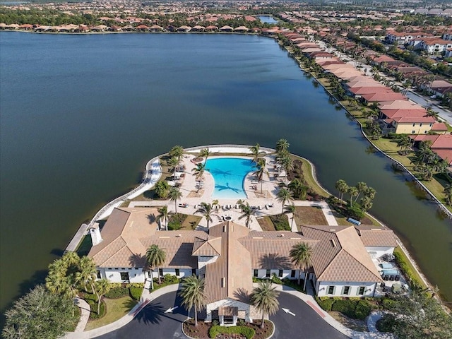 birds eye view of property featuring a water view