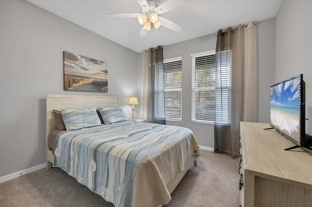 bedroom featuring carpet, baseboards, and a ceiling fan