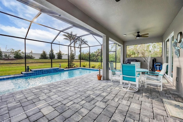 pool featuring ceiling fan, outdoor dining area, a lanai, a yard, and a patio area