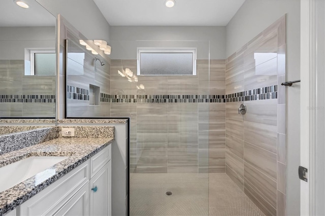 bathroom with vanity and a walk in shower