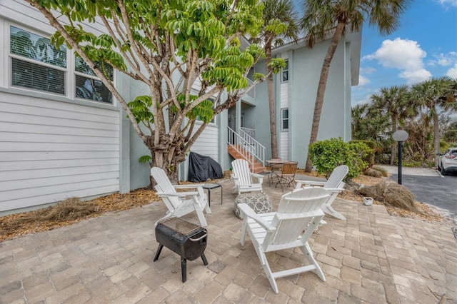 view of patio featuring an outdoor fire pit