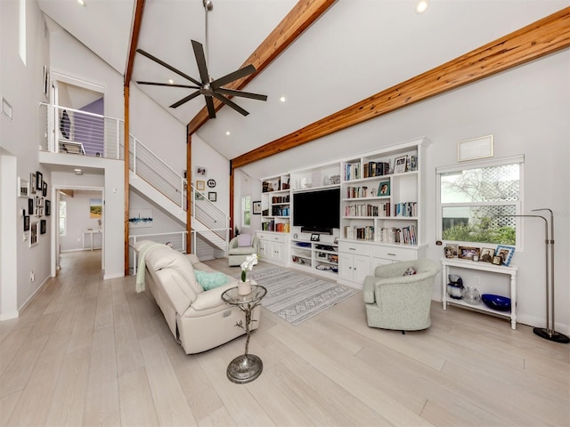 living room with high vaulted ceiling, ceiling fan, light hardwood / wood-style flooring, and beamed ceiling