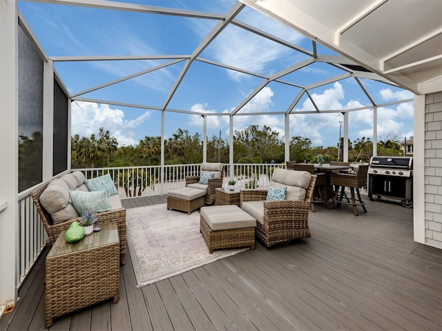 wooden deck featuring grilling area, an outdoor living space, and glass enclosure