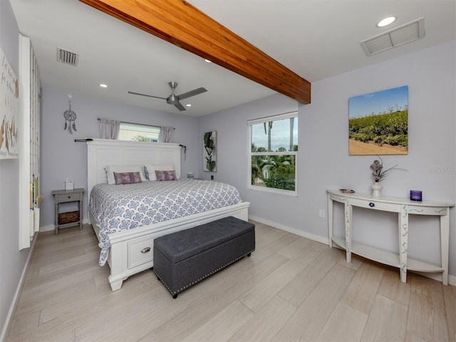 bedroom featuring ceiling fan, light hardwood / wood-style floors, and beamed ceiling