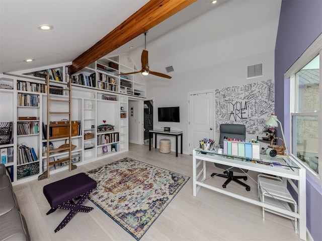 office space featuring ceiling fan and vaulted ceiling with beams