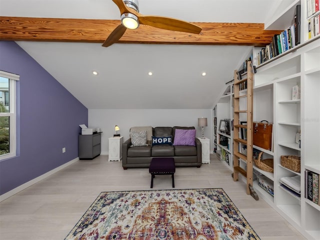 living room featuring light hardwood / wood-style flooring, vaulted ceiling with beams, and built in shelves