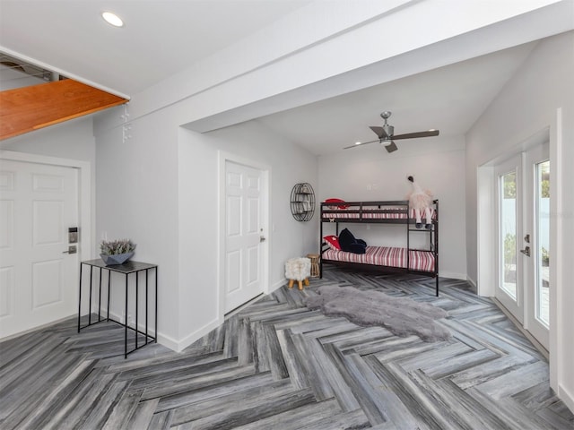 entryway with ceiling fan and dark parquet flooring