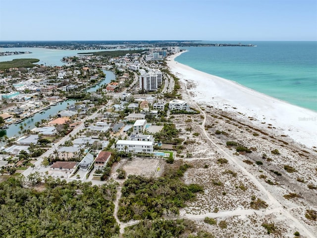 drone / aerial view with a water view and a view of the beach