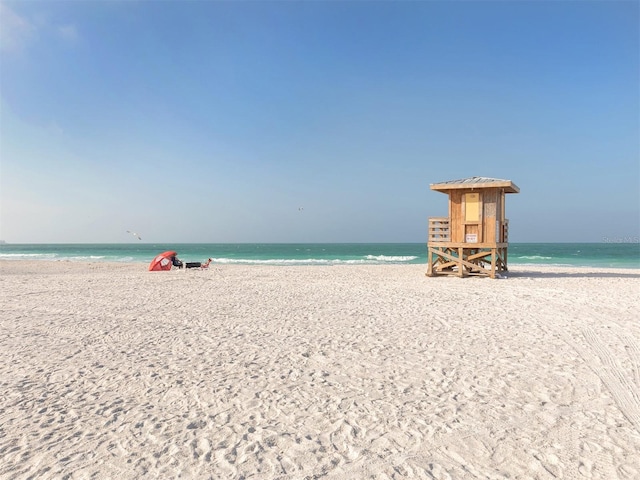 property view of water featuring a beach view