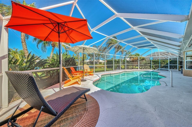 view of pool featuring a lanai and a patio