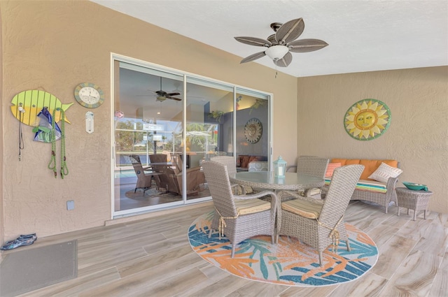 interior space with light hardwood / wood-style floors and ceiling fan