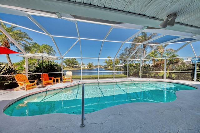 view of swimming pool with a water view, a patio, and a lanai