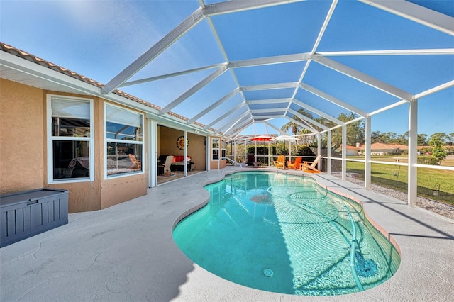 view of pool featuring a lanai and a patio