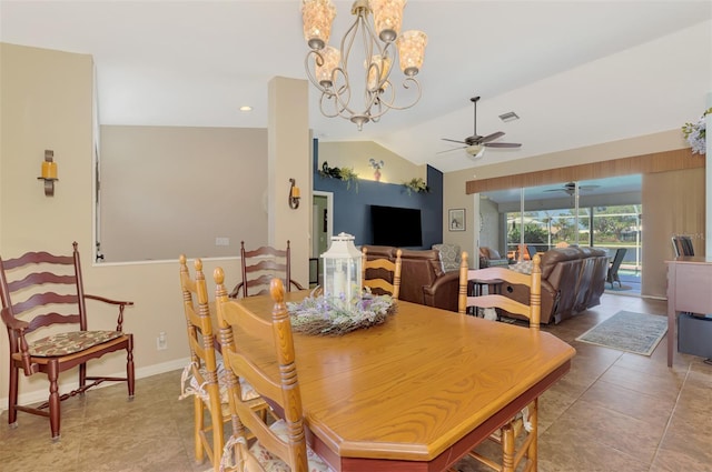 dining room with tile patterned flooring, lofted ceiling, and ceiling fan with notable chandelier