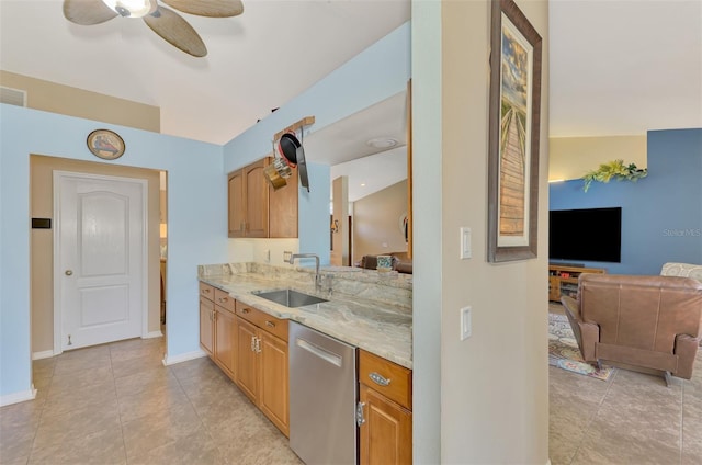 kitchen featuring sink, light tile patterned floors, ceiling fan, light stone countertops, and stainless steel dishwasher