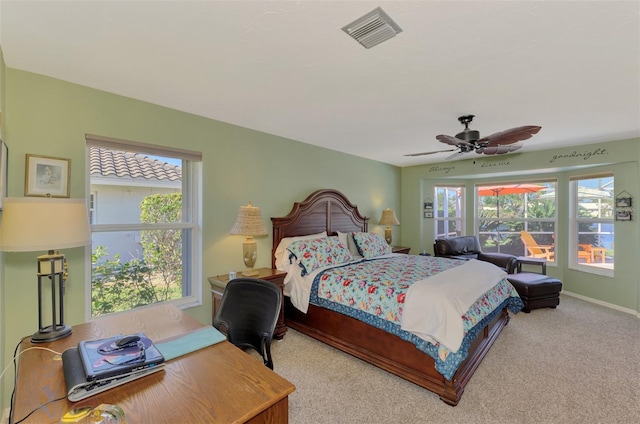 bedroom featuring ceiling fan and carpet