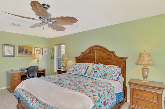 bedroom with ceiling fan and light carpet