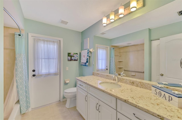 full bathroom with vanity, shower / tub combo, tile patterned floors, and toilet