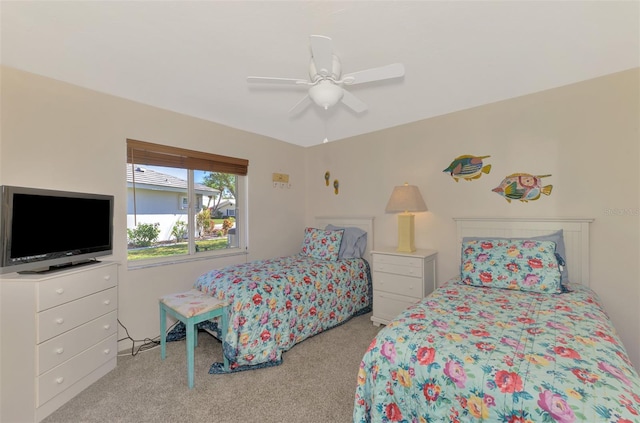 bedroom featuring ceiling fan and light colored carpet