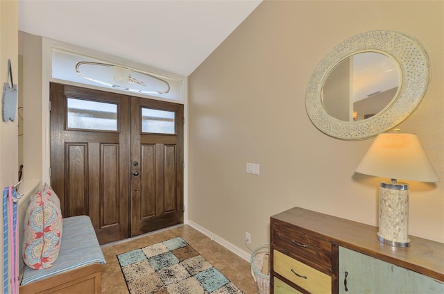 foyer entrance featuring lofted ceiling