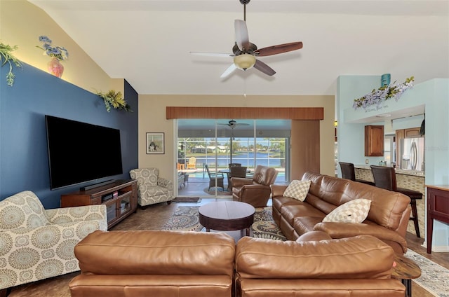 living room with ceiling fan and lofted ceiling