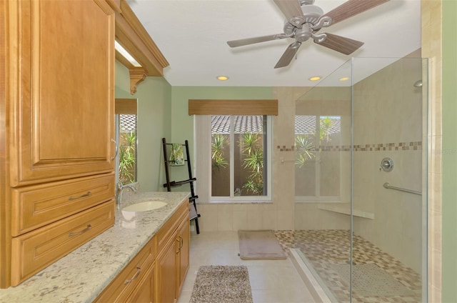 full bath featuring recessed lighting, vanity, a stall shower, and tile patterned floors