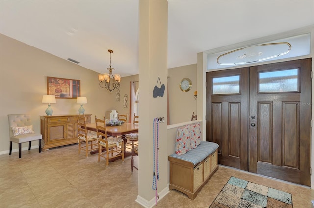 entryway featuring visible vents, baseboards, an inviting chandelier, and vaulted ceiling
