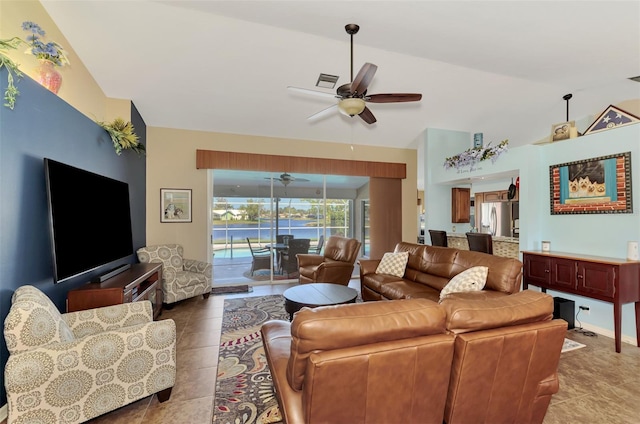 living room with ceiling fan, visible vents, tile patterned floors, and high vaulted ceiling