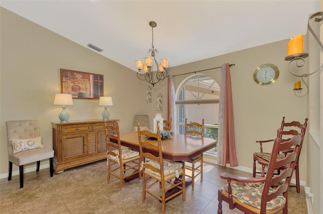 tiled dining area featuring visible vents, baseboards, a chandelier, and vaulted ceiling