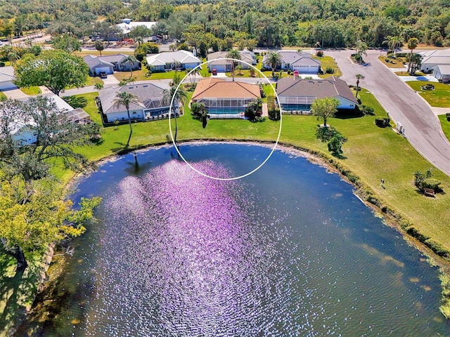 bird's eye view featuring a water view and a residential view