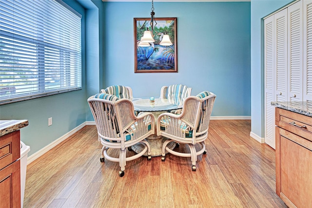 dining area with light wood-type flooring