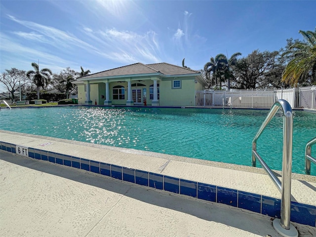 view of swimming pool featuring a patio area and french doors