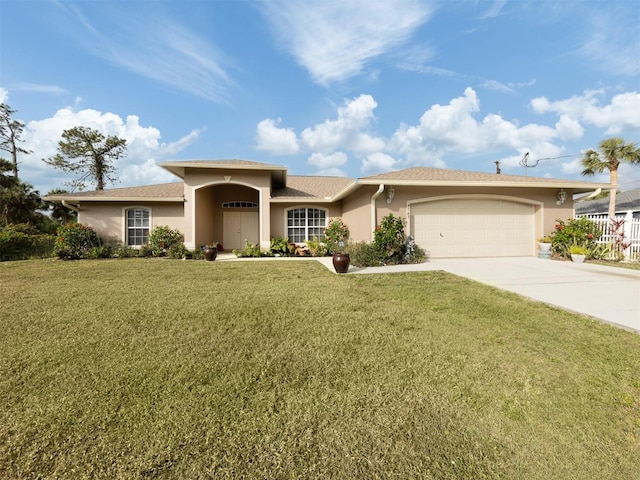 view of front of property featuring a garage and a front yard