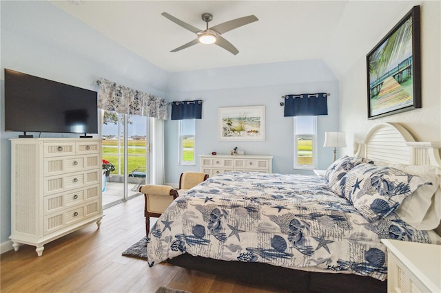 bedroom featuring access to exterior, ceiling fan, and light hardwood / wood-style flooring