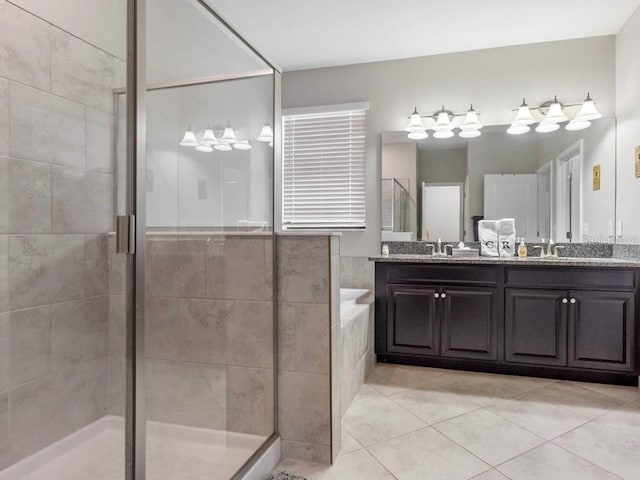 bathroom featuring plus walk in shower, tile patterned floors, and vanity