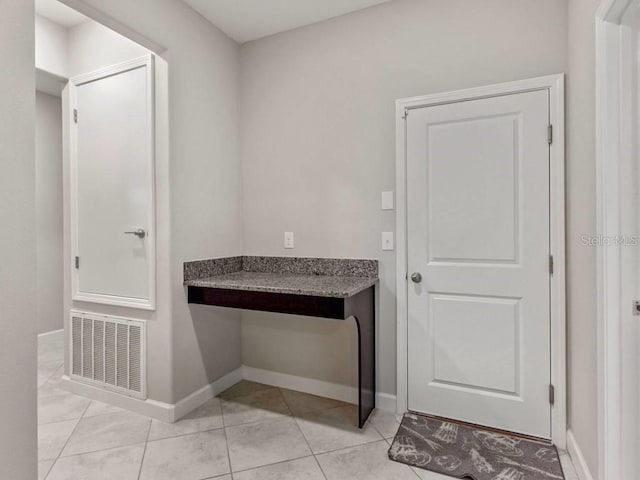 interior space featuring light tile patterned flooring