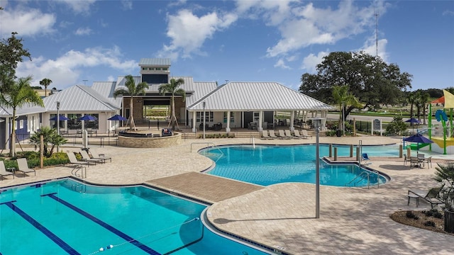 view of swimming pool with a patio