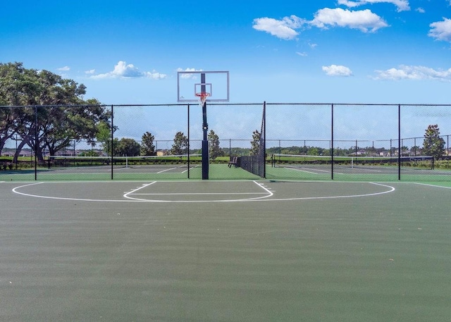 view of basketball court featuring tennis court