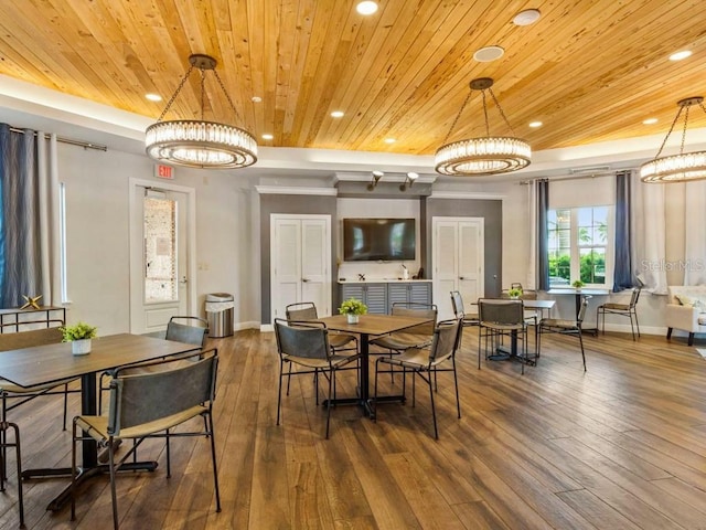 dining room featuring dark wood-type flooring, a notable chandelier, and wooden ceiling