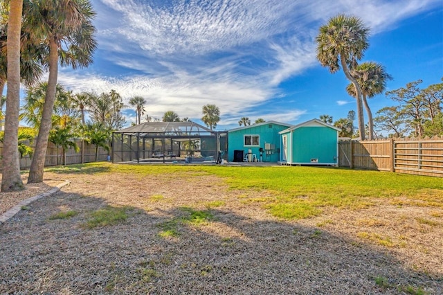 view of yard featuring glass enclosure