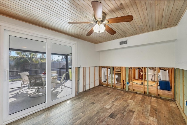 spare room with hardwood / wood-style flooring, wooden ceiling, and ceiling fan