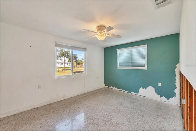 spare room with ceiling fan