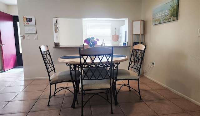 dining area featuring tile patterned floors