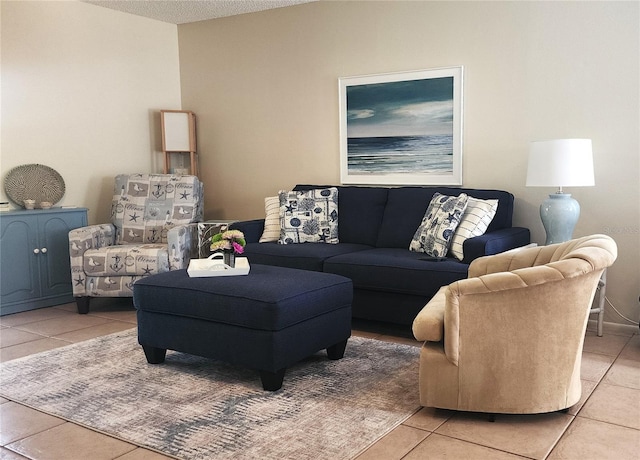 tiled living room featuring a textured ceiling